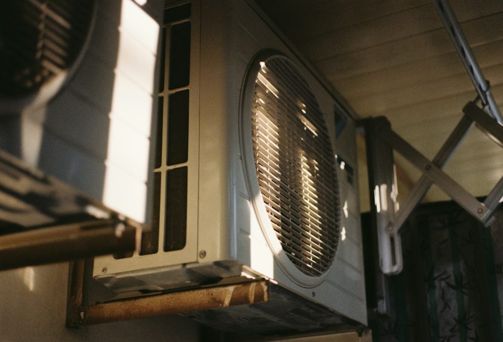 Outdoor air conditioning unit for condensate drain maintenance guide