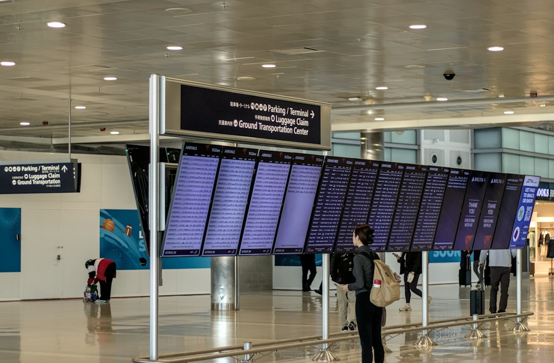 Traveler checking flight information at an airport