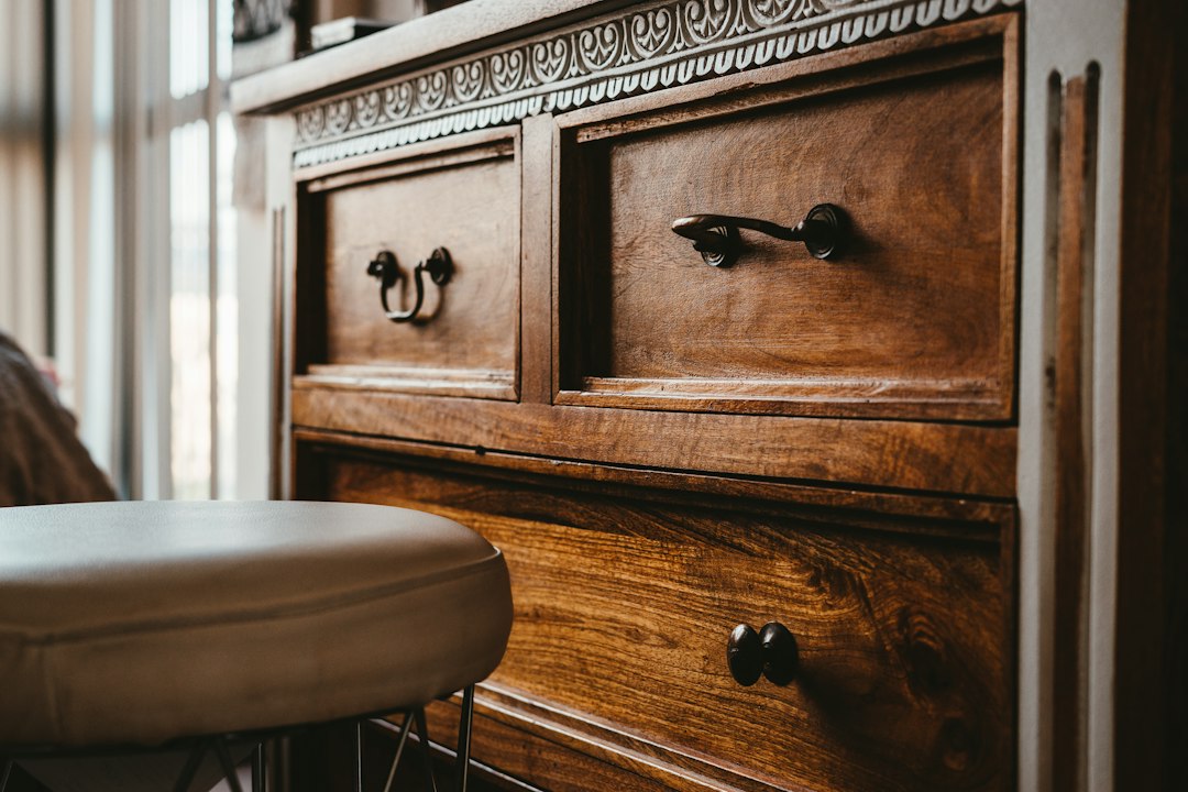 Wooden dresser with multiple drawers in a bedroom