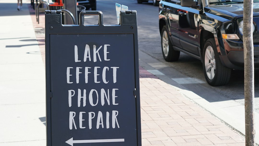 Local repair service sign viewed on a city street