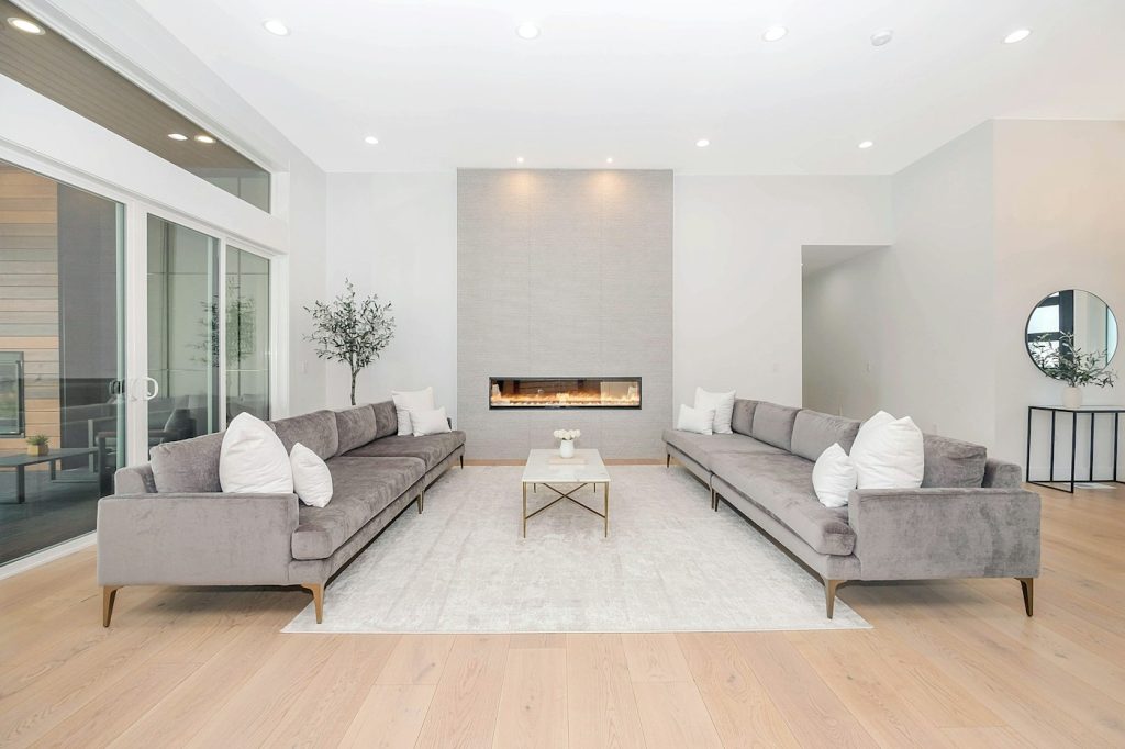 Bright modern living room with large windows and finished flooring