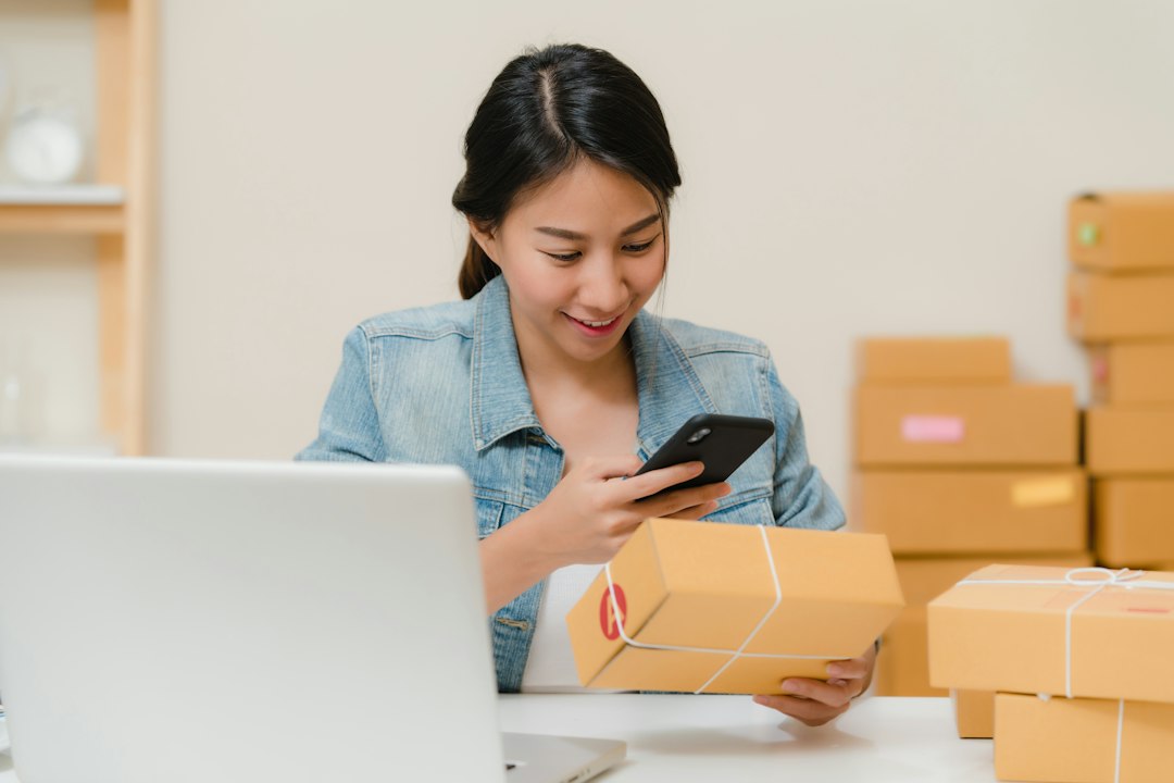 Small business owner handling ecommerce packages