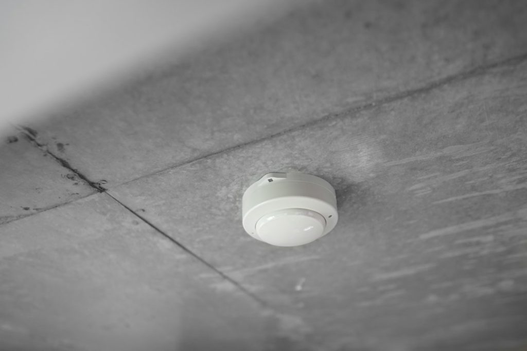 Smoke alarm installed on a home ceiling