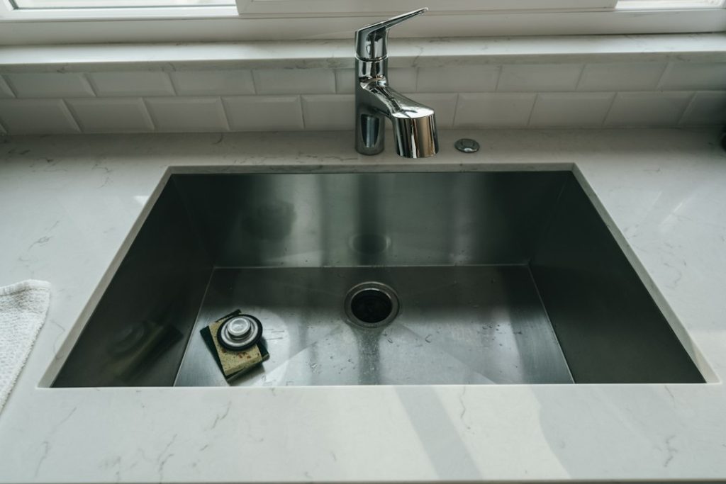 Kitchen sink for under-sink leak inspection guide