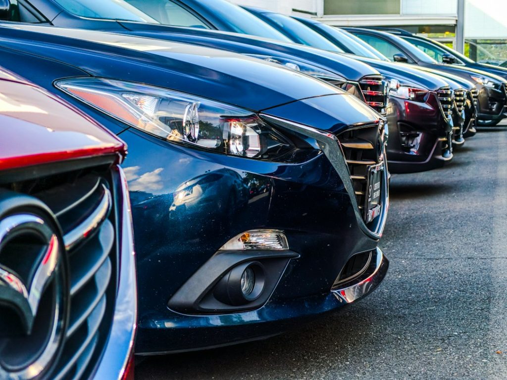 Used cars lined up at a dealership